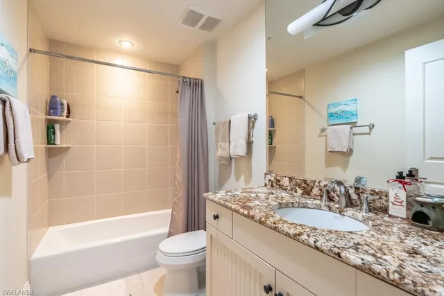 a bedroom with furniture and a wooden floor