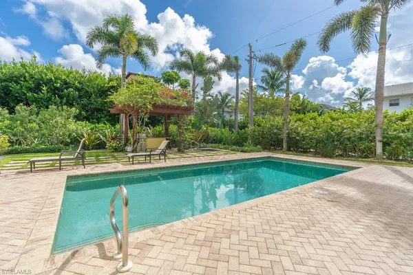 a view of a swimming pool with a patio