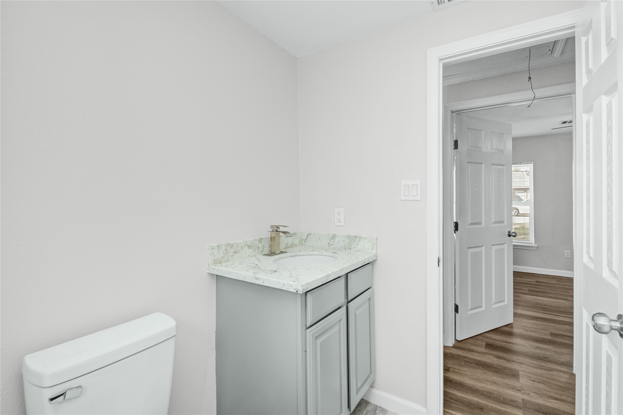 207 East Bernard Street Clute, TX 77531 - Photo 17 of 25 a bathroom with a sink toilet and vanity