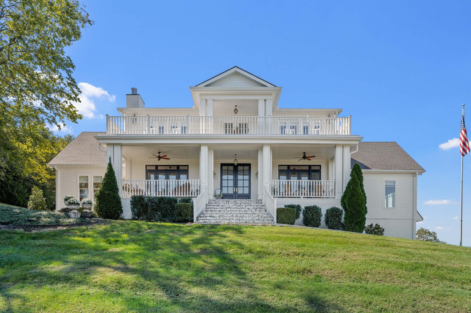 a front view of a house with a garden