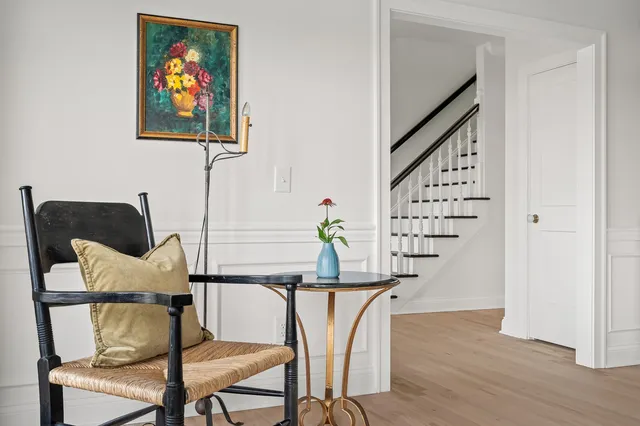 a kitchen with a stove a sink and a wooden cabinets