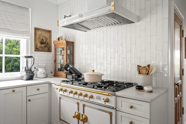 a bath tub sitting next to a bathroom sink
