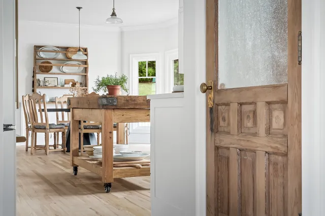 a view of a balcony with couch and wooden floor