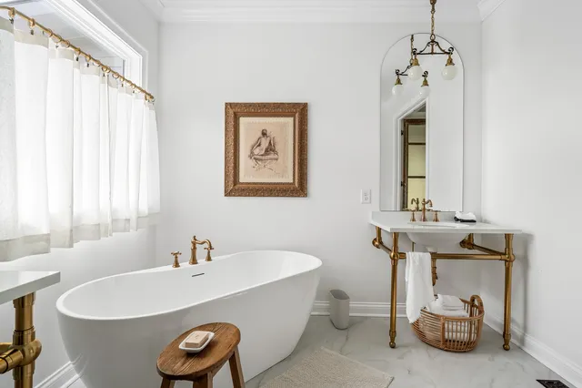 an aerial view of residential house with outdoor space and trees all around