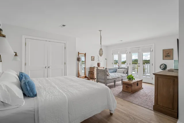 a view of a backyard with swimming pool and trees in the background