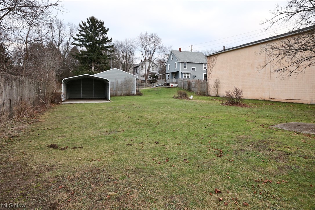 1309 Krumroy Road Akron, OH 44306 - Photo 24 of 30 View of yard featuring a carport