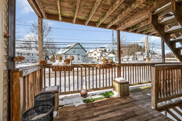 a view of a chair and table in the balcony