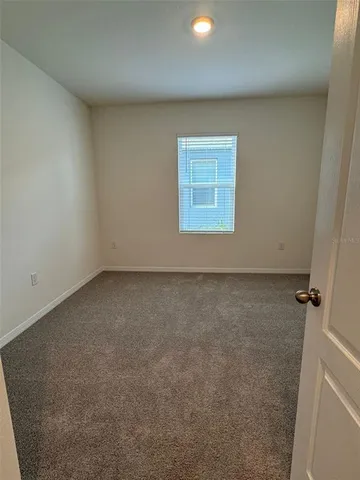a view of a water fountain and a big yard