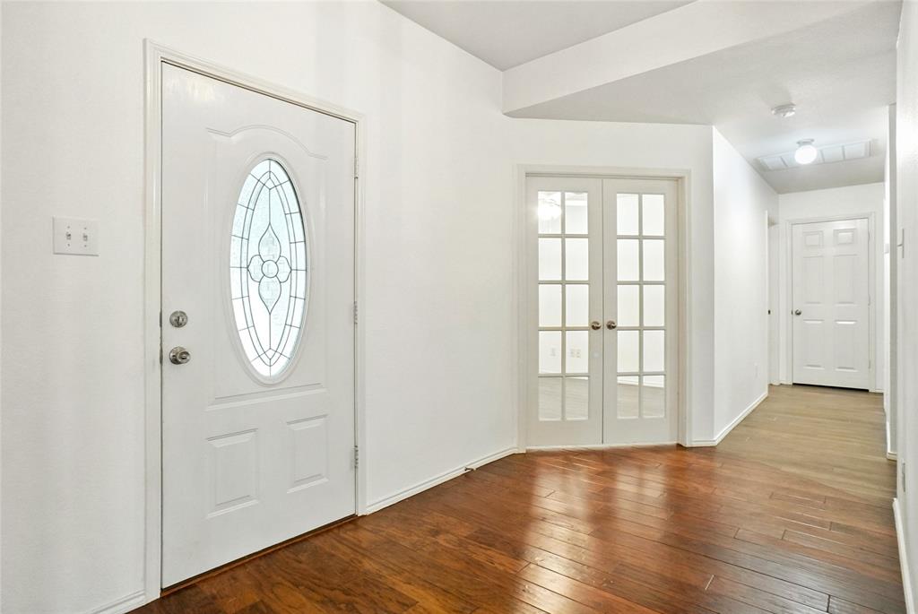 9907 Divine Court Frisco, TX 75033 - Photo 12 of 31 Entryway with wood-type flooring and french doors