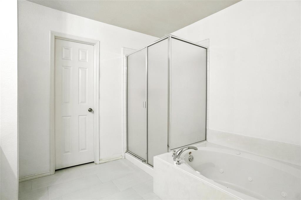 9907 Divine Court Frisco, TX 75033 - Photo 18 of 31 Bathroom with a whirlpool tub, a shower stall, and light tile patterned floors
