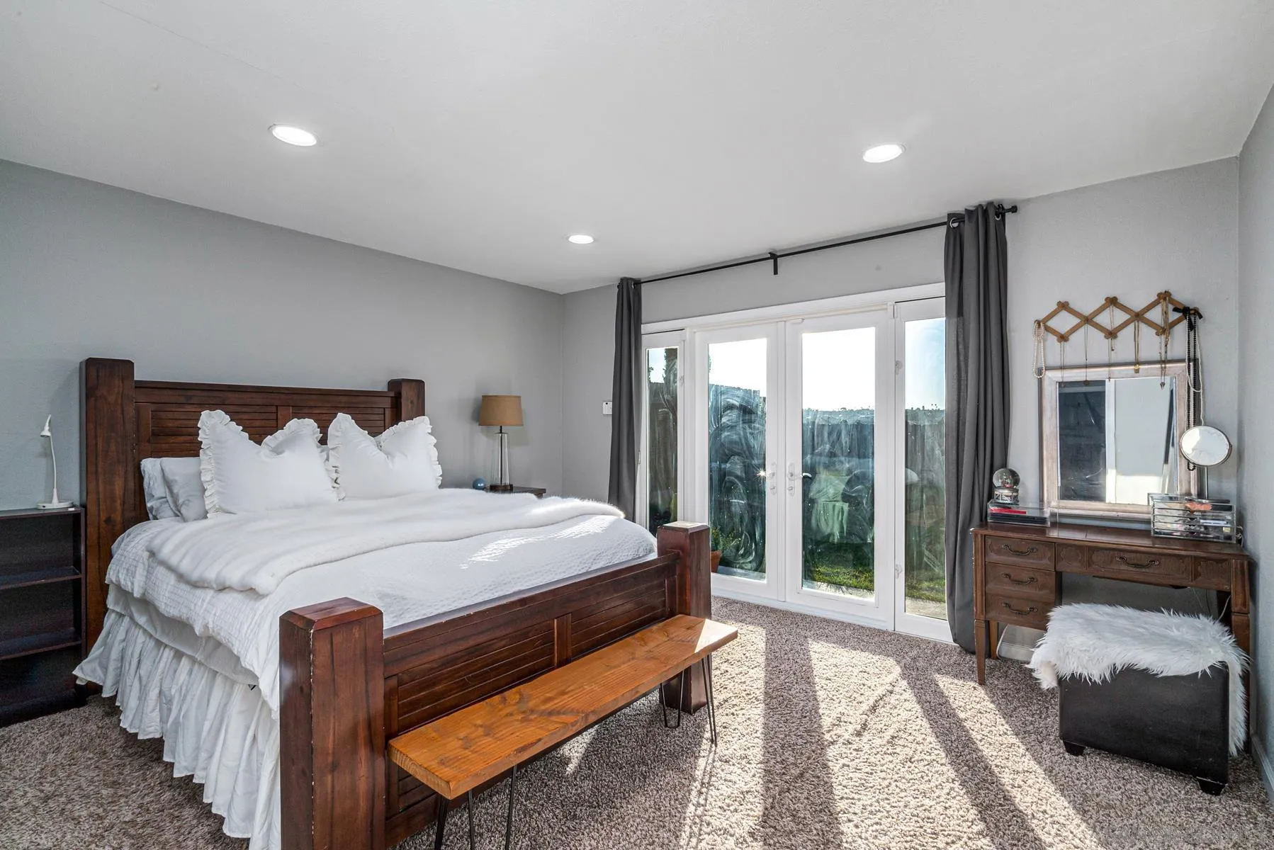 560 Kempton Street Spring Valley, CA 91977 - Photo 22 of 23 a bedroom with a large bed and a large window