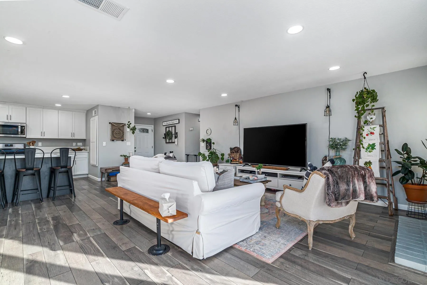 560 Kempton Street Spring Valley, CA 91977 - Photo 8 of 23 a living room with furniture and a flat screen tv
