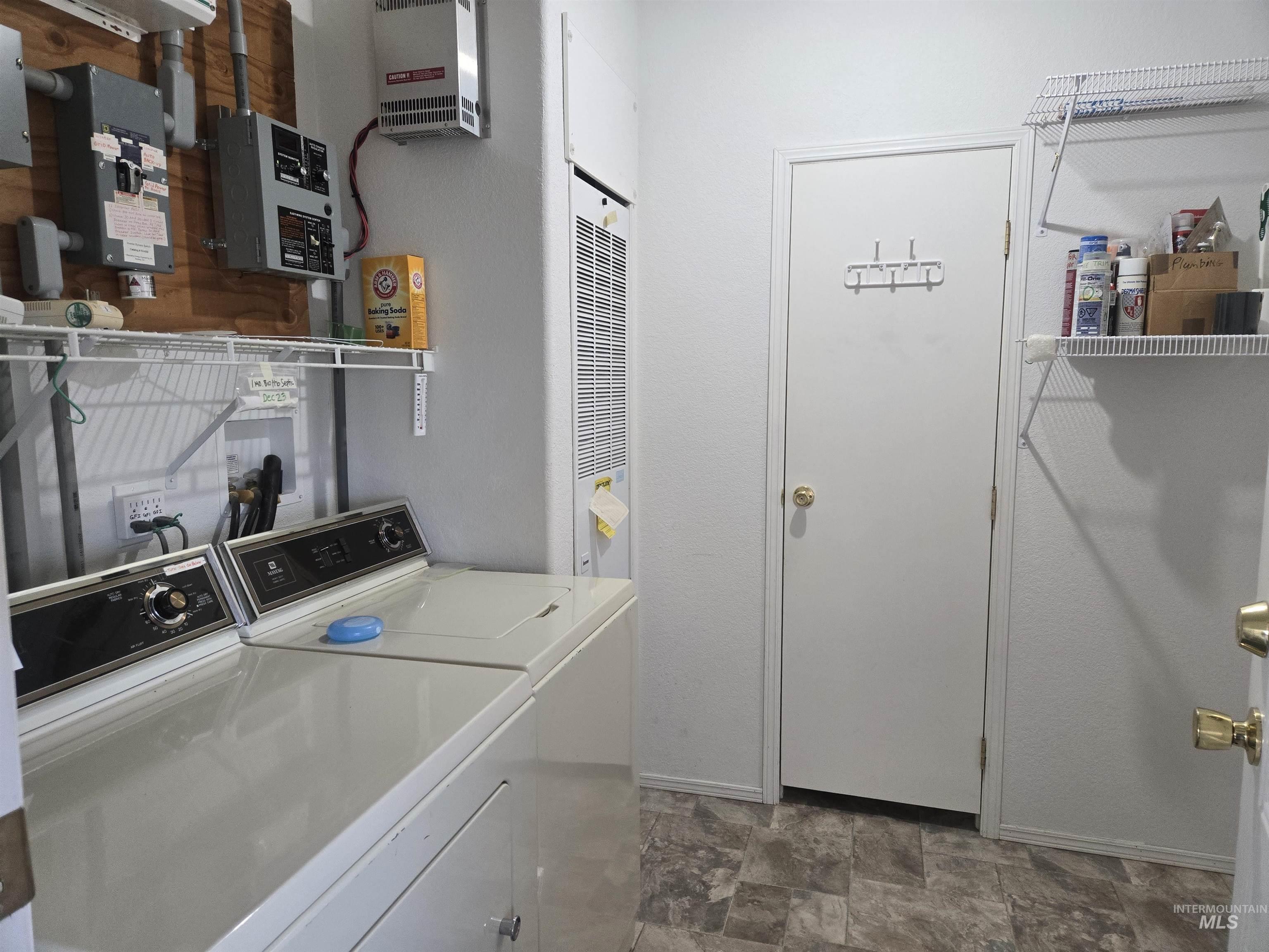 135 Harrisburg Road Kamiah, ID 83536 - Photo 7 of 30 Laundry room with stone finish floors and independent washer and dryer
