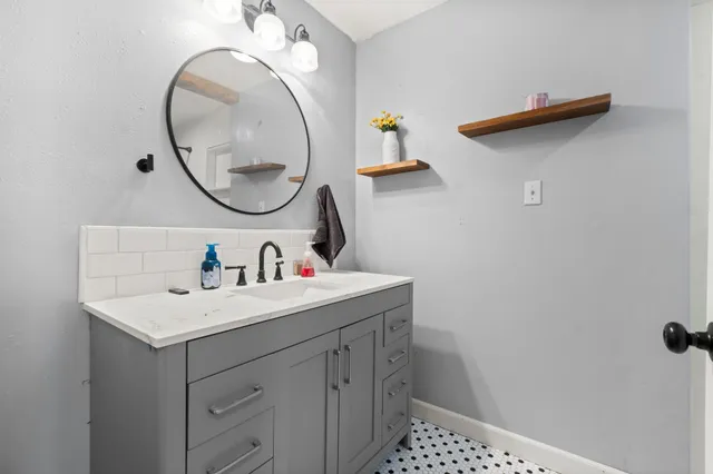 a white toilet sitting next to a bath tub and a shower