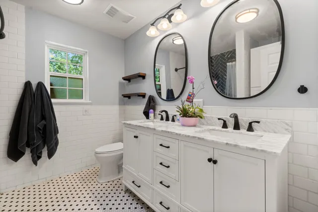 a view of walk in closet with clothes