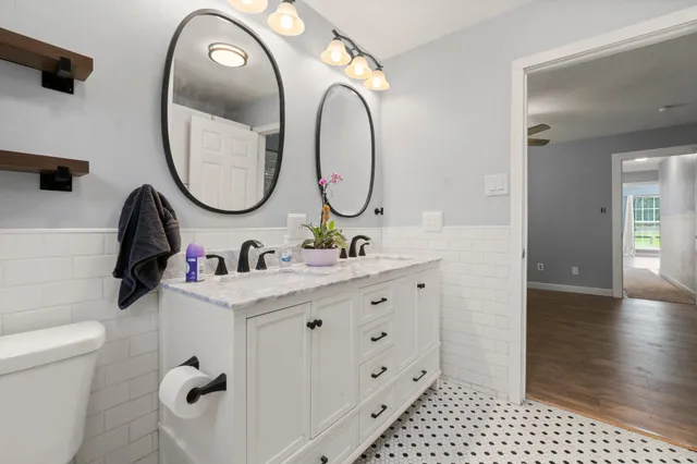 a view of a patio with table and chairs under an umbrella