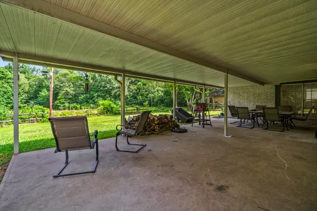 a view of a house with backyard and a slide