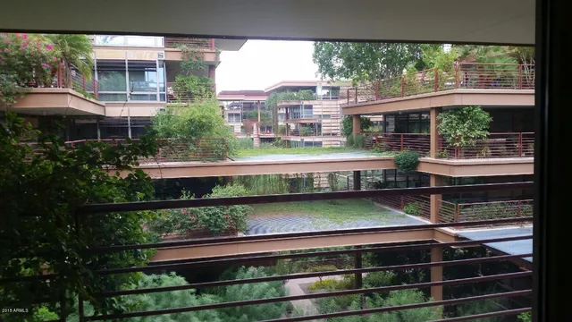 a view of a back yard from a balcony