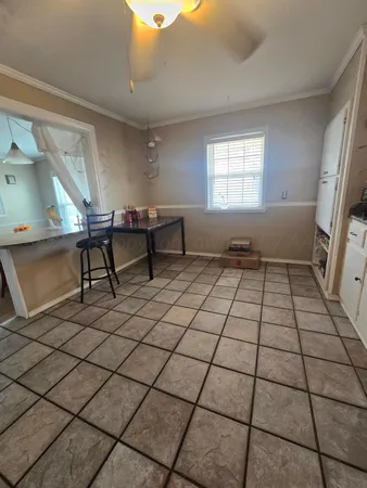 a living room with a black white checkered floor