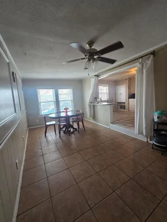 a room with lots of table and chairs