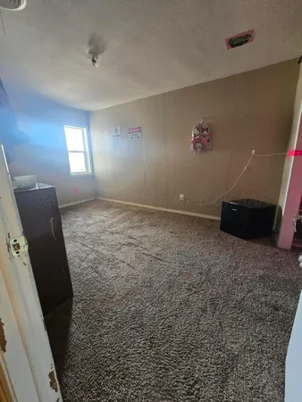 a bed room with a bed and a tv