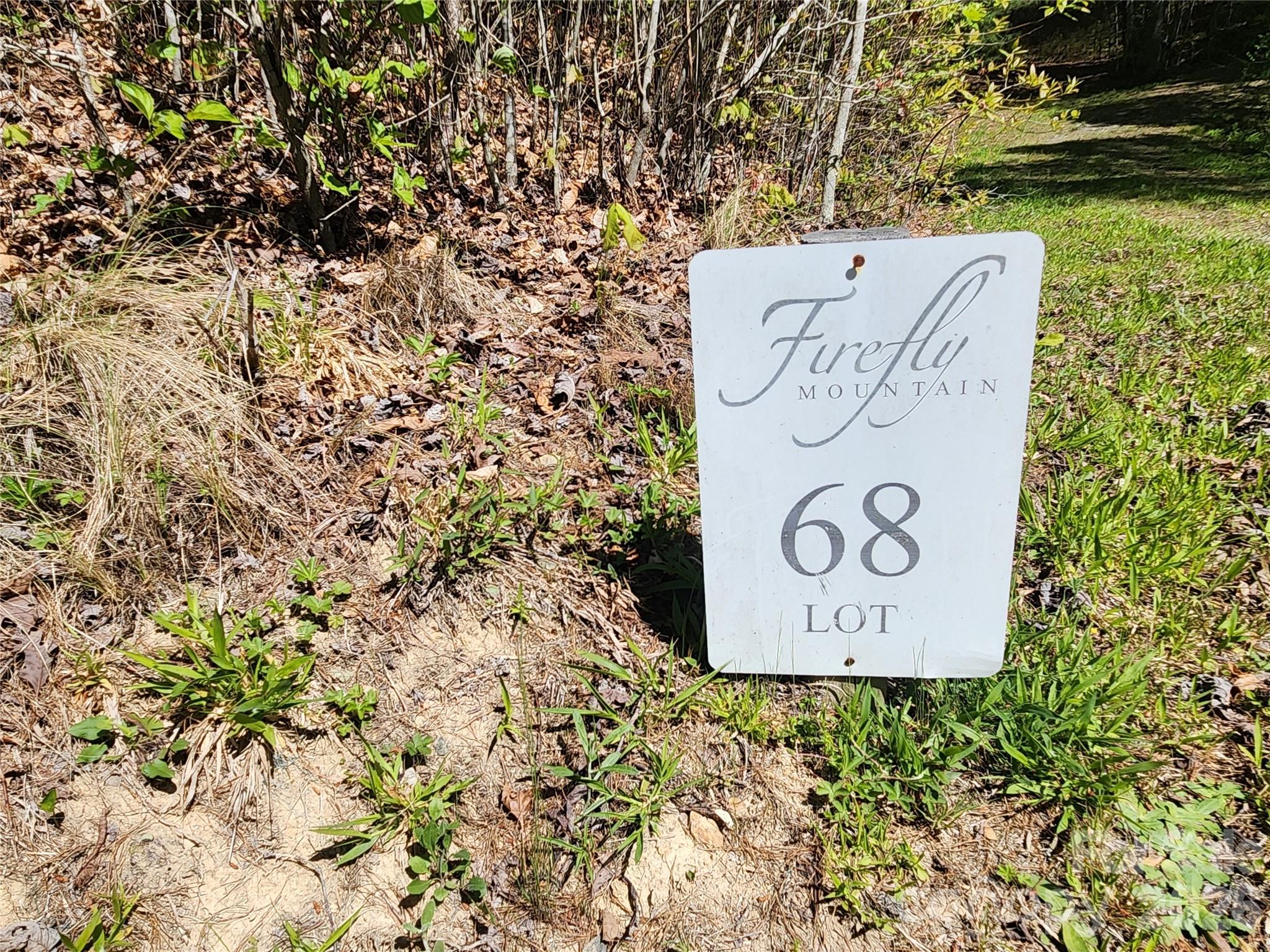889 Firefly Trail Marshall, NC 28753 - Photo 15 of 35 a sign that is sitting on a wooden floor