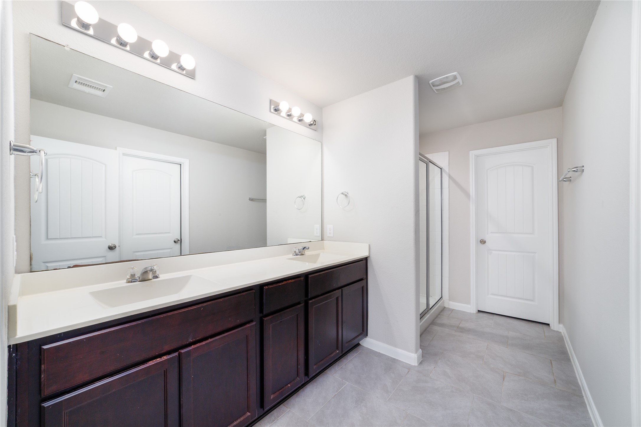 8307 Oakleaf Meadow Court Rosharon, TX 77583 - Photo 21 of 39 a bathroom with a double vanity sink mirror and double