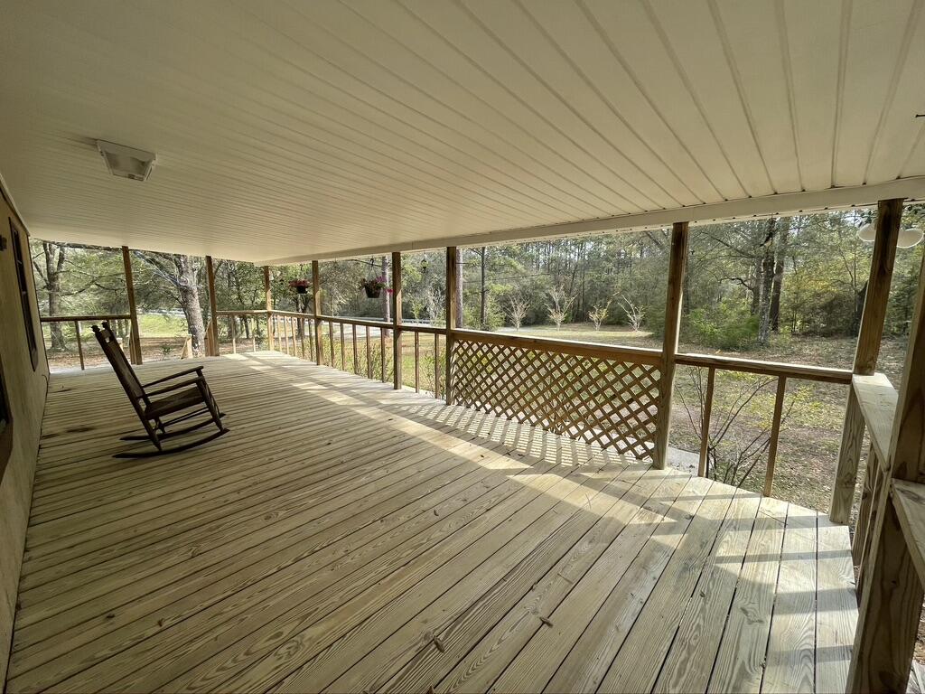 4223 Poverty Creek Road Crestview, FL 32539 - Photo 1 of 27 a view of a balcony with wooden floor