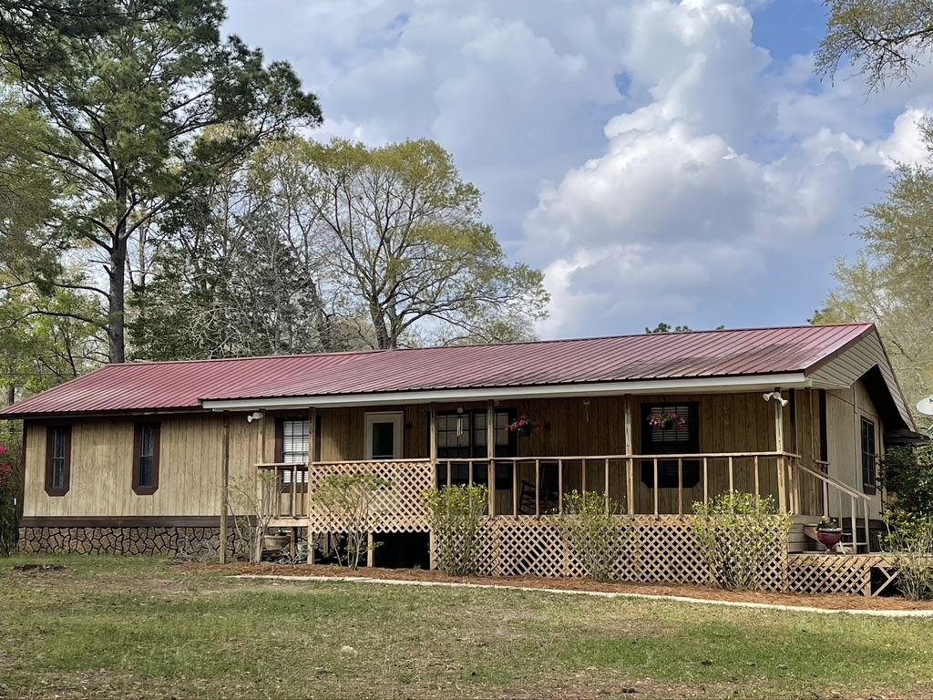 4223 Poverty Creek Road Crestview, FL 32539 - Photo 18 of 27 a front view of a house with a yard