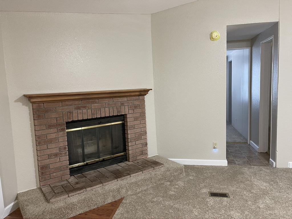 4223 Poverty Creek Road Crestview, FL 32539 - Photo 20 of 27 a living room with a fireplace