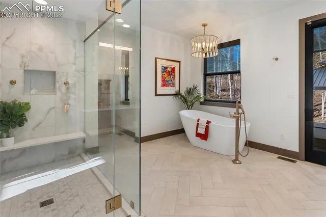 a storage room with window and chandelier