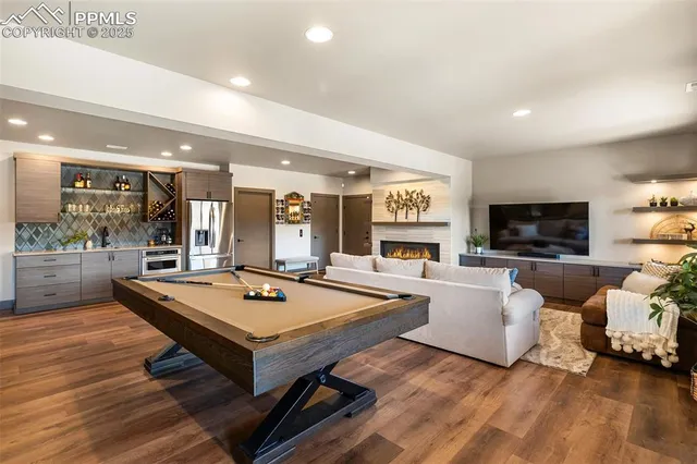 a living room with furniture and flat screen tv