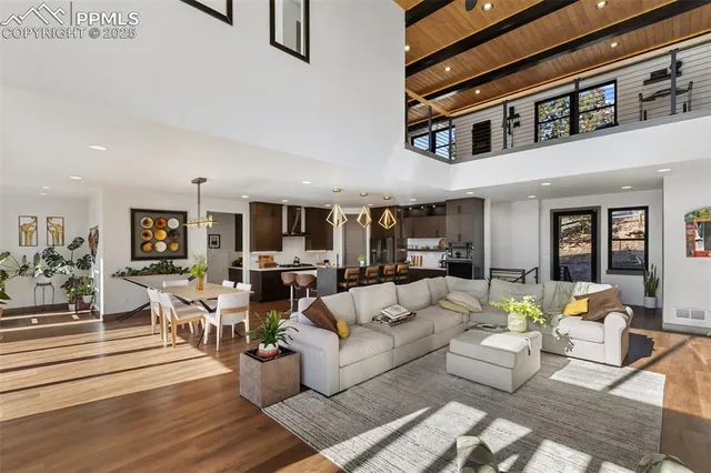 a living room with furniture or couch and a ceiling fan