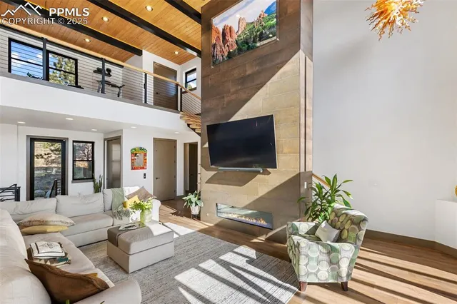 a view of a patio with couches table and chairs with potted plants