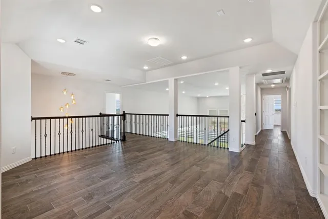 a view of staircase with wooden floor and windows