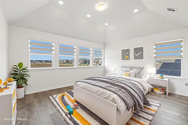 a bedroom with bed and a window