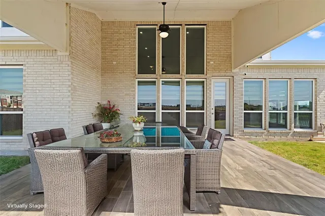 a view of a dining room with a table and chairs