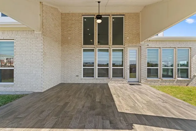 front view of a house with a large window