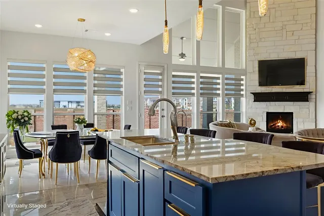 a kitchen with a counter space a sink appliances and cabinets