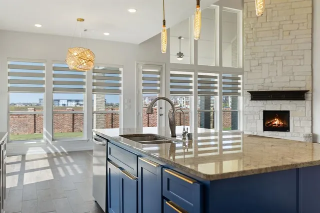 a kitchen with granite countertop a stove and a sink