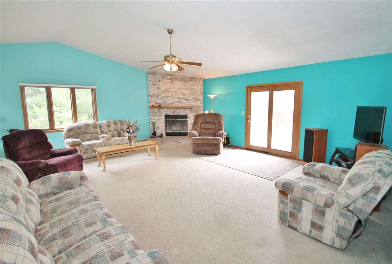 4247 Waltham Road Roscoe, IL 61073 - Photo 4 of 19 a living room with furniture and a fireplace
