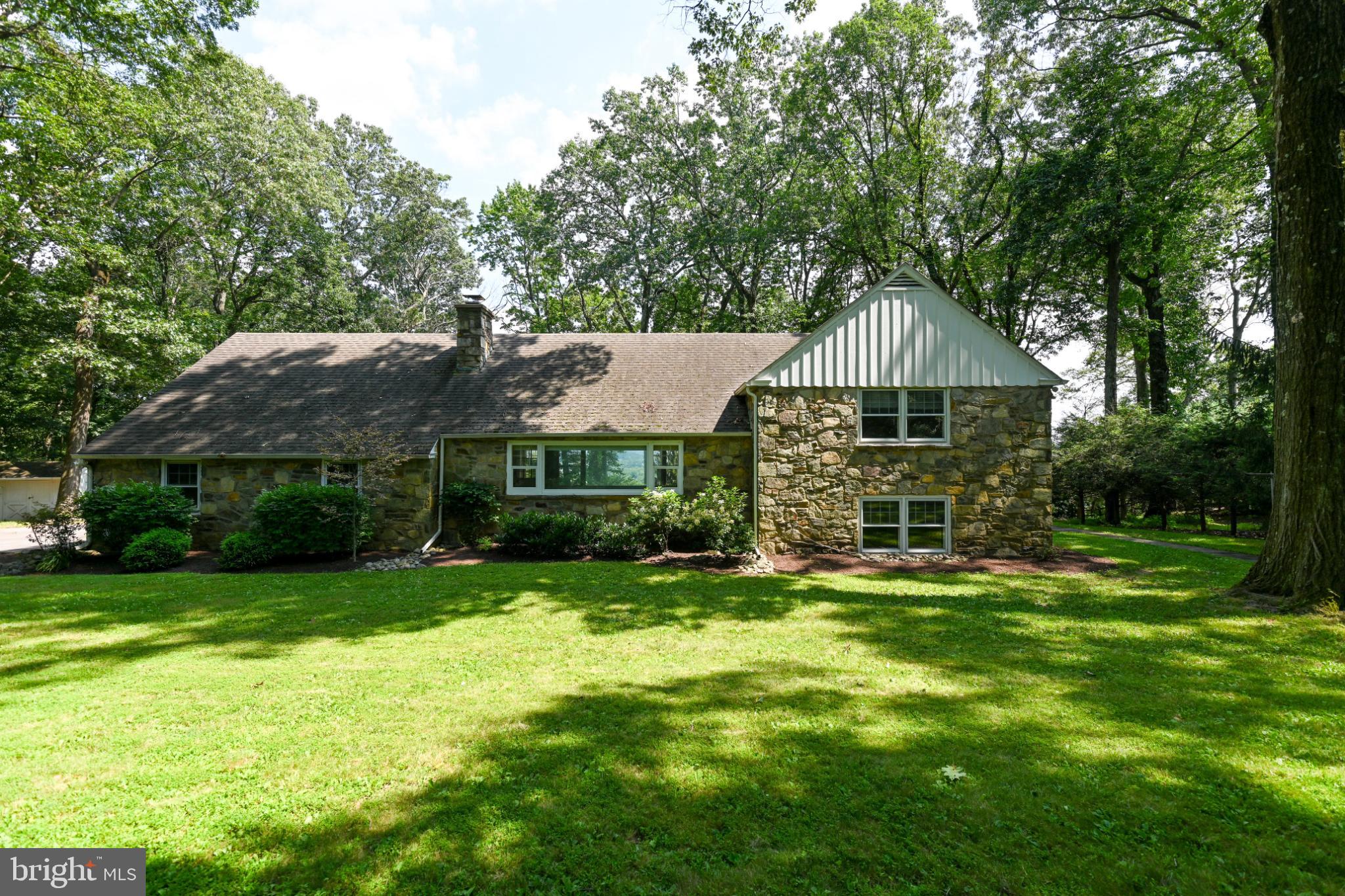 1531 North Ridge Road Perkasie, PA 18944 - Photo 1 of 30 a view of a house with a yard potted plants and large tree