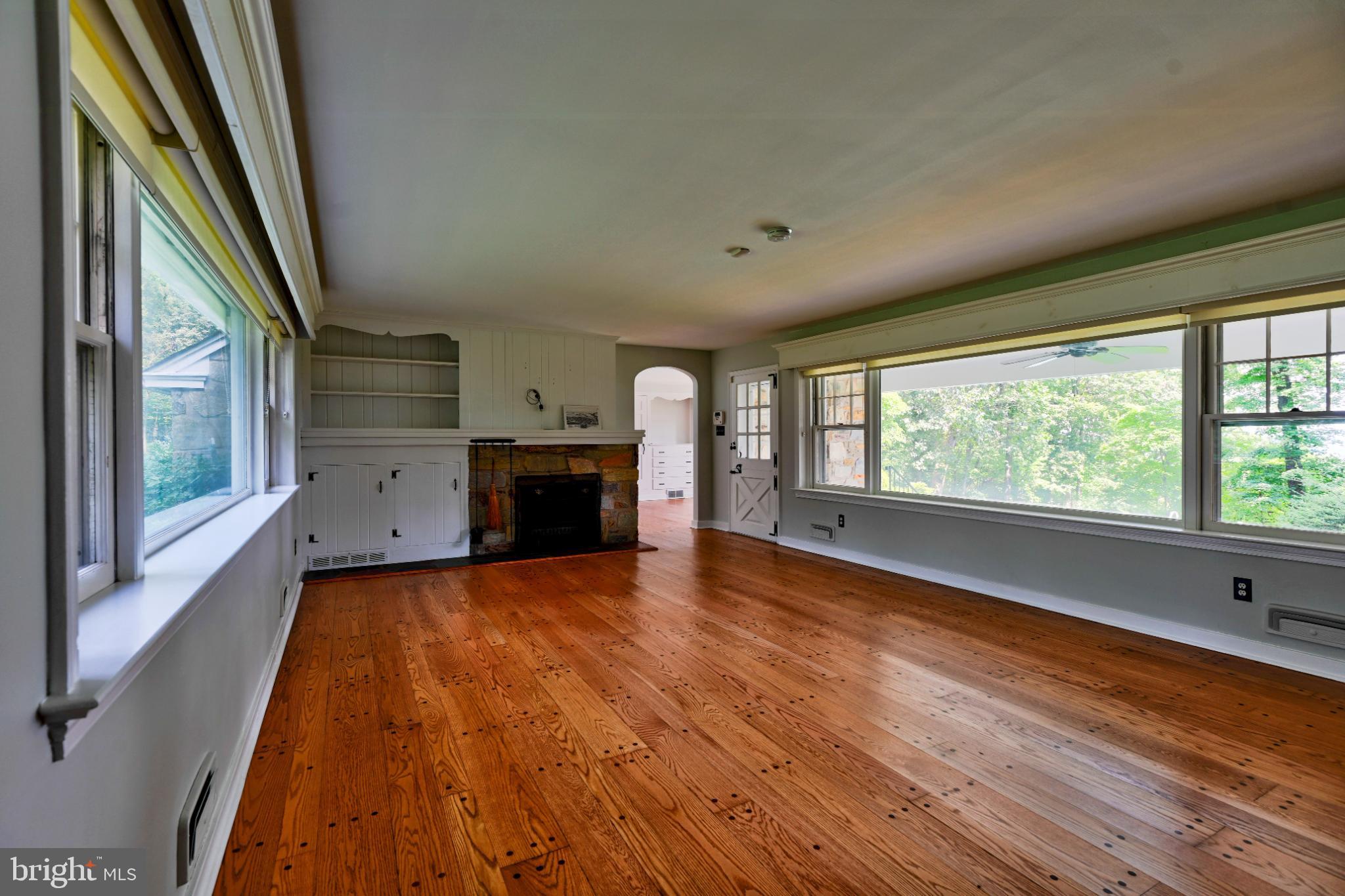 1531 North Ridge Road Perkasie, PA 18944 - Photo 11 of 30 a view of empty room with wooden floor and fan
