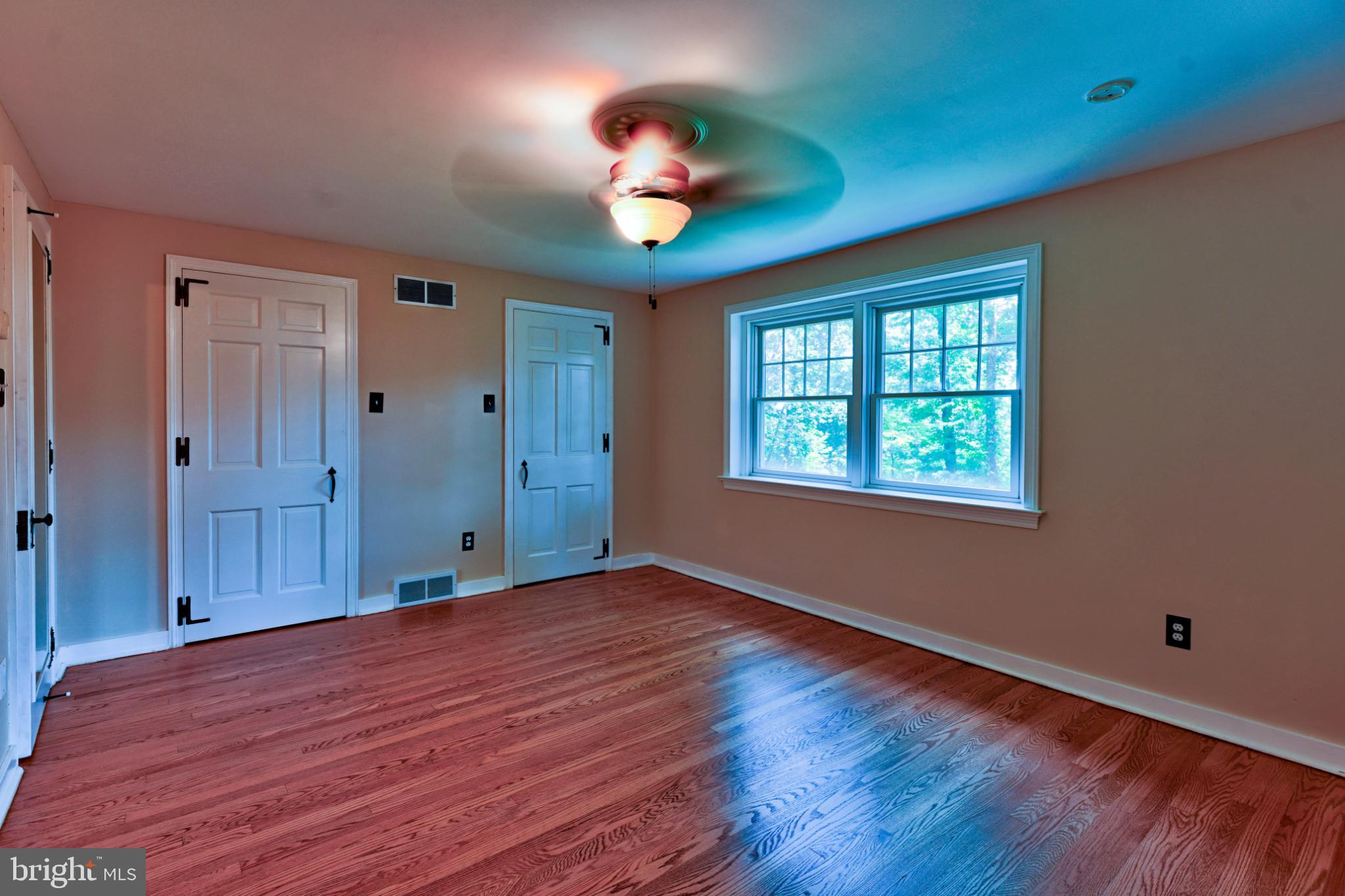 1531 North Ridge Road Perkasie, PA 18944 - Photo 16 of 30 a view of an empty room with window and wooden floor