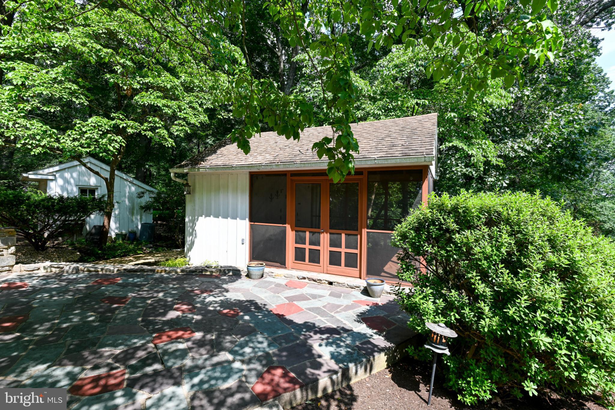 1531 North Ridge Road Perkasie, PA 18944 - Photo 24 of 30 a front view of a house with a garden and trees