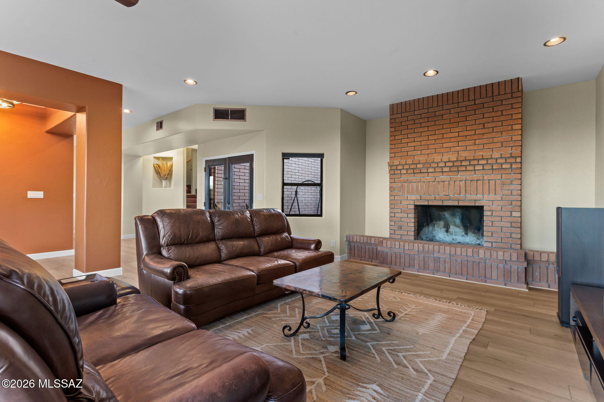 4210 West Mossman Road Tucson, AZ 85746 - Photo 11 of 51 a living room with furniture and a fireplace