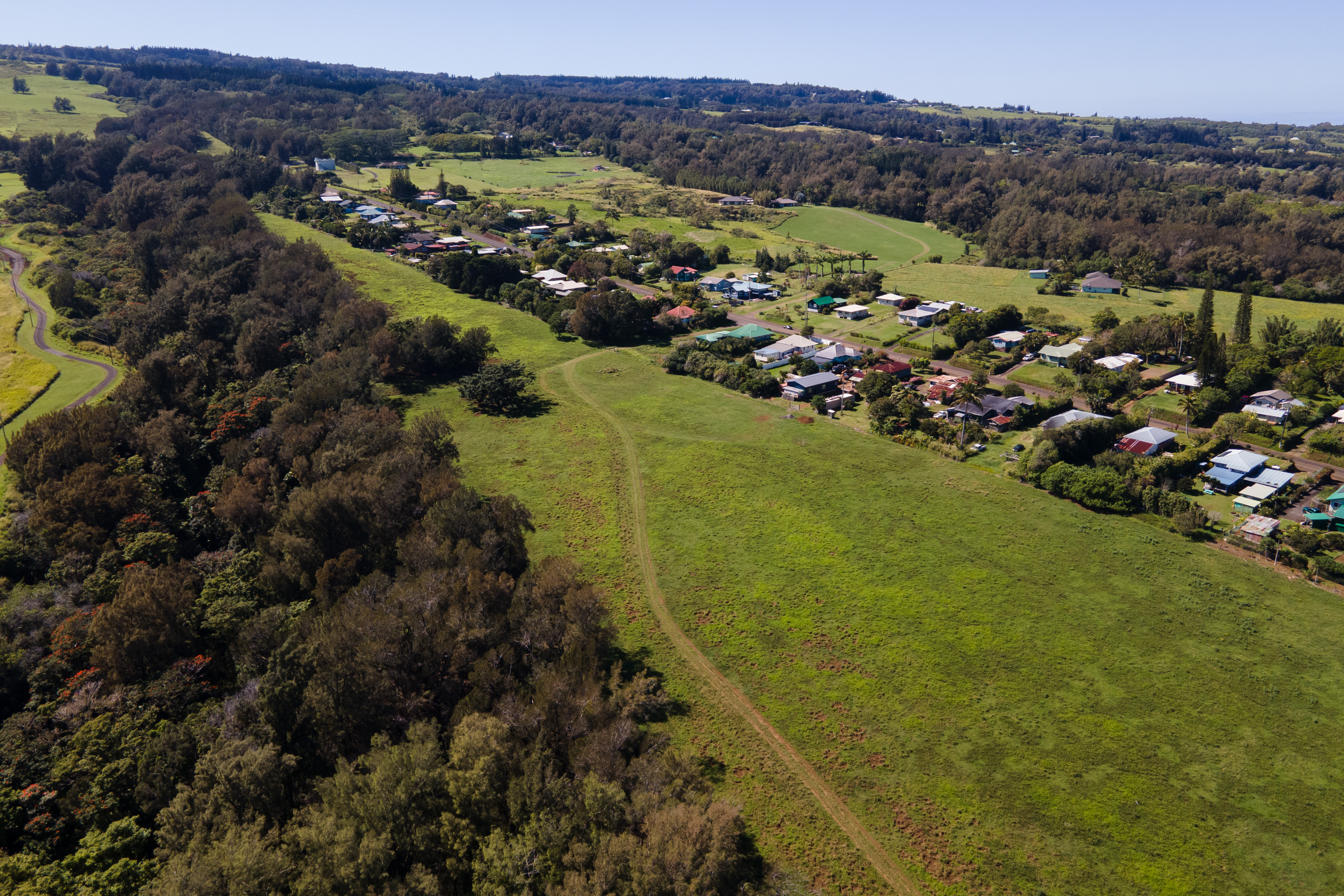 54-2340 Kynnersley Road Kapaau, HI 96755 - Photo 15 of 23 a view of a city with mountains in the background