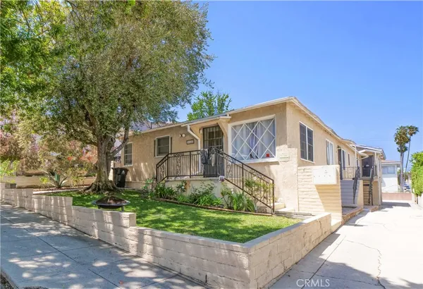 front view of a house with a yard