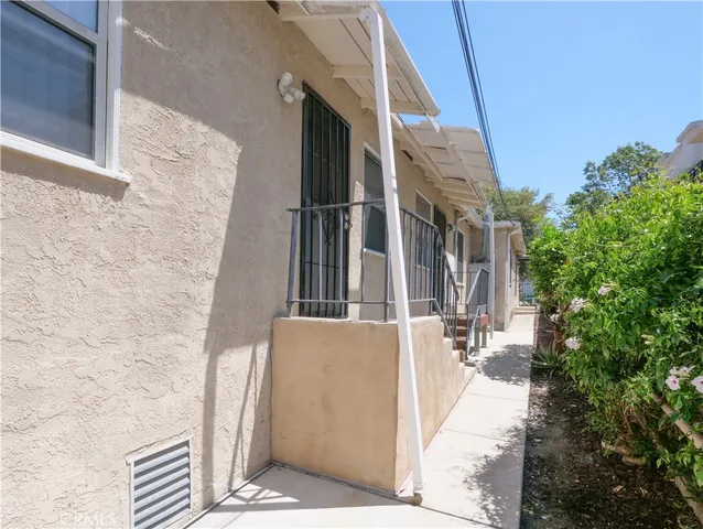 a view of a brick building with many windows