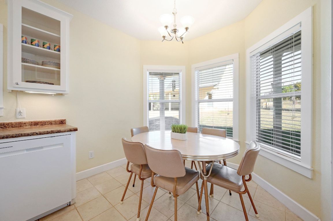 881 Saddle Ridge Drive Wimberley, TX 78676 - Photo 14 of 30 a view of a dining room with furniture and window
